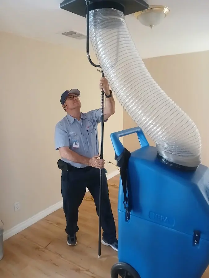 Furnace Tune-Up technician using HEPA equipment in Peachtree City